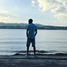 Chris Smith a.k.a. CLS, enjoying the view by the Caribbean Sea by the coastline in Portland Jamaica in an Instagram post.