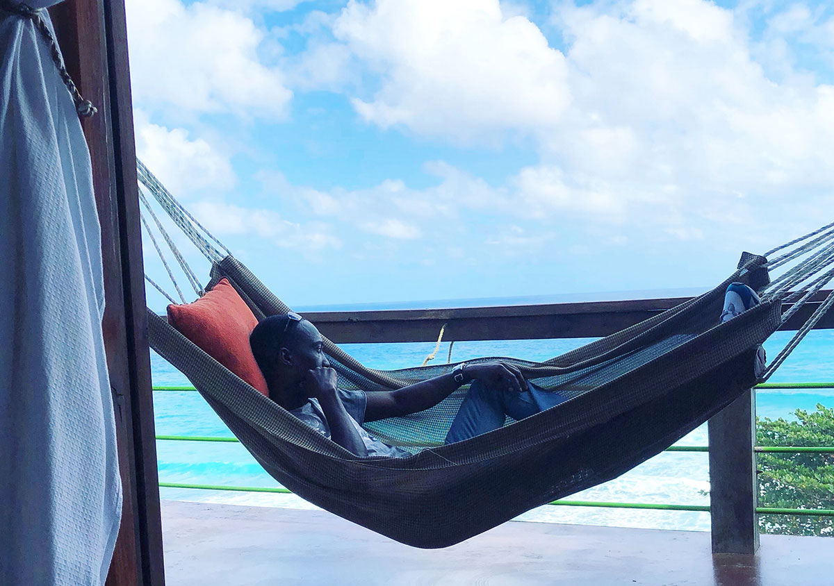 Chris Smith a.k.a. CLS relaxing in a hammock at Sea Cliff Resort in Portland Jamaica..